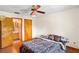 This bright bedroom features wood-look floors, access to the bathroom, and ample closet space at 13345 Convent Garden Rd, Brooksville, FL 34613