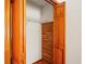 Open closet with wood walls, shelving and door hardware at 13345 Convent Garden Rd, Brooksville, FL 34613