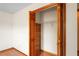 Bedroom closet with built-in shelving and wood look flooring at 13345 Convent Garden Rd, Brooksville, FL 34613