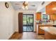 Kitchen with appliances and access to a screened lanai and backyard at 13345 Convent Garden Rd, Brooksville, FL 34613