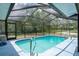 Private screened-in pool with lush landscaping at 13345 Convent Garden Rd, Brooksville, FL 34613