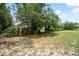 Large lot with fencing and gate with shade trees at 13345 Convent Garden Rd, Brooksville, FL 34613