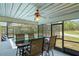 Screened lanai with outdoor dining table with pool view at 13345 Convent Garden Rd, Brooksville, FL 34613