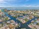 Waterfront community featuring convenient canal access, boat docks, and serene water views from above at 13836 Darlene Ave, Hudson, FL 34667