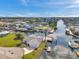 Beautiful waterfront home with private dock and boat lift, surrounded by lush landscaping and canal access at 13836 Darlene Ave, Hudson, FL 34667