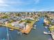 Waterfront home featuring a private dock, boat lift, and canal access, set amidst a picturesque neighborhood at 13836 Darlene Ave, Hudson, FL 34667