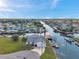 Stunning aerial view of a waterfront property with direct canal access and private boat dock at 13836 Darlene Ave, Hudson, FL 34667