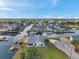 Beautiful aerial view of waterfront property with docks and boat access at 13836 Darlene Ave, Hudson, FL 34667