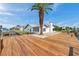A wide, canal-front backyard features a dock and boat lift at 13836 Darlene Ave, Hudson, FL 34667