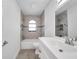Bright bathroom showcasing a shower-tub combo and a modern vanity at 13836 Darlene Ave, Hudson, FL 34667