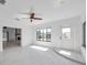 Bonus room with plenty of light, tile floors, and view of canal at 13836 Darlene Ave, Hudson, FL 34667