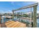 Private dock featuring boat lifts, a fish cleaning table, and gorgeous waterfront views at 13836 Darlene Ave, Hudson, FL 34667