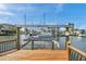 Boat lift at private dock with waterway access at 13836 Darlene Ave, Hudson, FL 34667