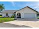 Stunning single-story waterfront home with a two-car garage and lush landscaping in a beautiful neighborhood at 13836 Darlene Ave, Hudson, FL 34667