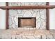 Close up of fireplace with stone and mantel at 13836 Darlene Ave, Hudson, FL 34667