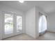 Bright entryway featuring tile floors, double front doors, and an open layout at 13836 Darlene Ave, Hudson, FL 34667