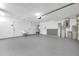 Spacious garage with a sink, water heater, and plenty of room for parking and storage at 13836 Darlene Ave, Hudson, FL 34667