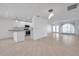 Bright kitchen with white cabinets, stainless steel appliances, and tile floors at 13836 Darlene Ave, Hudson, FL 34667