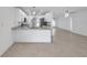 Bright and airy modern kitchen with a view of the dining and living areas at 13836 Darlene Ave, Hudson, FL 34667