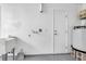 Functional laundry room featuring a utility sink and plenty of space at 13836 Darlene Ave, Hudson, FL 34667