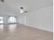 Spacious living area with neutral tile and a sunlit window at 13836 Darlene Ave, Hudson, FL 34667