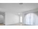 Bright room with light walls and a door to the outside at 13836 Darlene Ave, Hudson, FL 34667