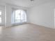 Bright living room with tile floors, a large window, and ample natural light at 13836 Darlene Ave, Hudson, FL 34667