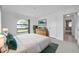 Main bedroom features neutral walls, and a decoratively framed window, and a dressing table at 13836 Darlene Ave, Hudson, FL 34667