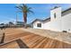 Gorgeous waterfront backyard with private dock, a tropical palm tree, and space for entertaining guests at 13836 Darlene Ave, Hudson, FL 34667