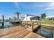 Beautiful waterfront property with a private dock, boat lift, and access to the open water at 13836 Darlene Ave, Hudson, FL 34667