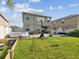 Spacious backyard with patio, pool, grass, and room for entertaining at 14000 Lugano Ct, Hudson, FL 34669