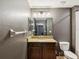 Bathroom with a vanity, granite countertop, and a modern light fixture at 14000 Lugano Ct, Hudson, FL 34669