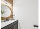 Half-bathroom with modern vanity, mirror, and lighting at 14000 Lugano Ct, Hudson, FL 34669