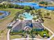 An aerial view showcasing the expansive community pool with tropical landscaping and comfortable lounge chairs at 14000 Lugano Ct, Hudson, FL 34669