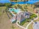 An aerial view showcasing a beautiful pool, clubhouse, and Gathering-friendly playground in a vibrant community at 14000 Lugano Ct, Hudson, FL 34669