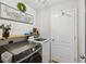 Convenient laundry room with modern washer and dryer, shelving, and decor at 14000 Lugano Ct, Hudson, FL 34669
