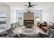 Bright living room featuring fireplace and ample seating at 14000 Lugano Ct, Hudson, FL 34669