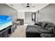 Spacious living area with a comfortable sectional, modern entertainment center, and neutral color scheme at 14000 Lugano Ct, Hudson, FL 34669