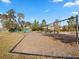 Community playground with swings, climbing structures, and a picnic area for Gathering fun and recreation at 14000 Lugano Ct, Hudson, FL 34669