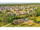 An aerial view of a playground with homes in the background in this Gathering-friendly community at 14000 Lugano Ct, Hudson, FL 34669