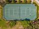 Aerial view of community tennis courts, perfect for outdoor recreation and sports at 14000 Lugano Ct, Hudson, FL 34669