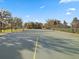 Community tennis court with green surface and chain-link fencing, providing recreational opportunities at 14000 Lugano Ct, Hudson, FL 34669