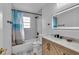 Bathroom featuring a vanity sink, toilet and shower with a light up mirror at 15950 Adobe Dr, Hudson, FL 34667
