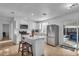 Modern kitchen with white cabinets, stainless steel appliances, and island at 15950 Adobe Dr, Hudson, FL 34667