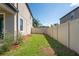 Cozy backyard space with a well-maintained lawn and privacy fence, offering a serene outdoor retreat at 18558 Cortes Creek Blvd, Spring Hill, FL 34610