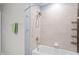 A tiled shower and bath inside the bathroom at 18558 Cortes Creek Blvd, Spring Hill, FL 34610