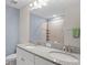 Bathroom features double sinks and a large mirror at 18558 Cortes Creek Blvd, Spring Hill, FL 34610