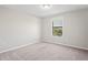 Bedroom with natural light and neutral colored carpet at 18558 Cortes Creek Blvd, Spring Hill, FL 34610