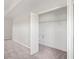 View of a carpeted walk-in closet with wire shelving and a small access door at 18558 Cortes Creek Blvd, Spring Hill, FL 34610
