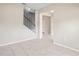 Entryway featuring tile flooring, staircase with white banister, and an open view of the front door at 18558 Cortes Creek Blvd, Spring Hill, FL 34610